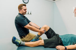 When should a Personal Trainer loop in an Athletic Therapist with a client?