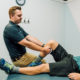 When should a Personal Trainer loop in an Athletic Therapist with a client?