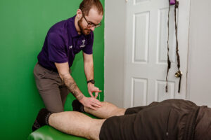 Tristan RMT performing Acupuncture