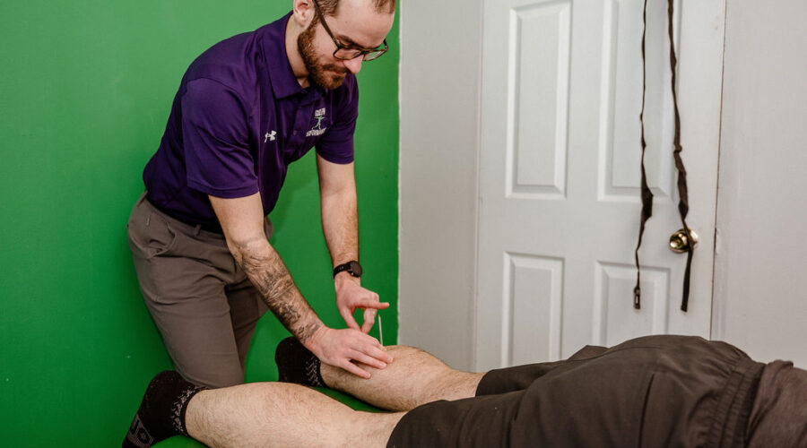 Tristan RMT performing Acupuncture